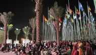 Ambassador of India H E Dr. Deepak Mittal and community members attend a performance at the Flag Plaza near Doha Corniche yesterday. 