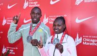 Benson Kipruto (left) and Ruth Chepngetich, both from Kenya, pose with their medals after they won the 2022 Chicago Marathon in Chicago, Illinois, on October 9, 2022. Mandatory Credit: Jamie Sabau-USA TODAY Sports