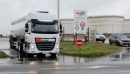 A fuel tanker leaves a TotalEnergies depot and former oil refinery, in Mardyck near Dunkerque, France, on October 13, 2022. REUTERS/Pascal Rossignol/File Photo