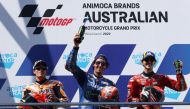 Team Suzuki Ecstar's Alex Rins celebrates on the podium with second placed Repsol Honda Team's Marc Marquez and third placed Ducati Lenovo's Francesco Bagnaia after winning the Australian Grand Prix at the Phillip Island Grand Prix Circuit, Phillip Island, Australia, on October 16, 2022.   REUTERS/Loren Elliott