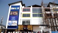 Members of media and Jammu and Kashmir government officials wait to enter a multi-screen cinema hall run by India's leading multiplex chain INOX before its inauguration in Srinagar, September 20, 2022. (REUTERS/Danish Ismail)