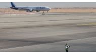 A Kuwait Airways plane parked at Cairo International Airport is pictured through the window of an airplane on a flight between Cairo and Doha, Egypt, on November 27, 2021. File Photo / Reuters
