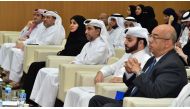 Deputy Speaker of the Shura Council H E Dr. Hamda bint Hassan Al Sulaiti (third left), President of QU Dr. Hassan Al Derhami (third right) with other dignitaries and participants of the workshop.