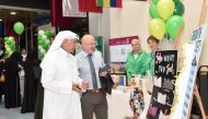 Officials at a stand during UDST's World Mental Health Day event.