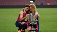 In this file photo taken on May 31, 2015, Barcelona's defender Gerard Pique and his wife Colombian singer Shakira pose with the trophy at the end of the Spanish Copa del Rey (King's Cup) final football match at the Camp Nou stadium in Barcelona. (Josep LAGO / AFP)