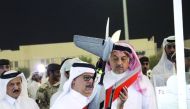 Deputy Prime Minister and Minister of State for Defence Affairs H E Dr. Khalid bin Mohammed Al Attiyah (right) inspecting an exhibit during the event.
