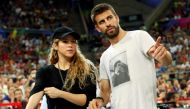 File photo: Colombian singer Shakira (L) and her partner, Barcelona soccer player Gerard Pique, attend the Basketball World Cup quarter-final game between the U.S. and Slovenia in Barcelona September 9, 2014. Reuters/Albert Gea/File Photo
 