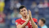 In this file photo taken on June 23, 2021 Poland's forward Robert Lewandowski reacts after losing the UEFA EURO 2020 Group E football match between Sweden and Poland at Saint Petersburg Stadium in Saint Petersburg. (Photo by Dmitry LOVETSKY / POOL / AFP)
 