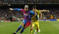 FC Barcelona's Ronald Araujo in action with Villarreal's Manu Trigueros at the LaLiga (FC Barcelona v Villarreal) Camp Nou, Barcelona, Spain, May 22, 2022. (REUTERS/Albert Gea)