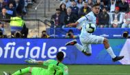 In this file photo taken on July 06, 2019 Argentina's Paulo Dybala (right) scores past Chile's goalkeeper Gabriel Arias during their Copa America football tournament third-place match at the Corinthians Arena in Sao Paulo, Brazil. (AFP/Nelson Almeida)