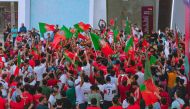 Portugal fans celebrate during a parade in Doha. 