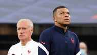 France’s Kylian Mbappe and coach Didier Deschamps during a training session. Reuters