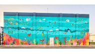 A wall mural painted by mixed media artist Mallika Jaiswal, Business Support Officer at the College of Health and Life Sciences at Hamad Bin Khalifa University.