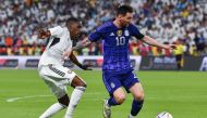 United Arab Emirates' defender Khalifa Al Hammadi (L) marks Argentina's forward Lionel Messi during the friendly football match between Argentina and the United Arab Emirates at the Mohammed Bin Zayed Stadium in Abu Dhabi, on November 16, 2022. (Photo by Ryan LIM / AFP)