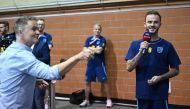 England's midfielder James Maddison (R) takes on a journalist at darts during a media session at the Al Wakrah Stadium in Doha on November 16, 2022, ahead of the Qatar 2022 World Cup football tournament. (Photo by Paul ELLIS / AFP)
 