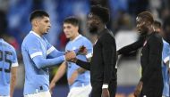 Canada's Alphonso Davies shakes hands with Uruguay's Mathias Oliveira (left) after their international friendly match at Tehelne pole, Bratislava, Slovakia, on September 27, 2022.  File Photo / Reuters
