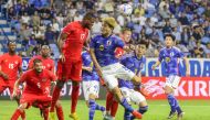 Canada's forward Cyle Larin and Japan's forward Ritsu Doan vie for a header during a friendly football match between Canada and Japan at Al Maktoum Stadium in Dubai, yesterday. Canada won 2-1. AFP