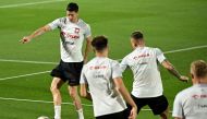 Poland's forward Robert Lewandowski (left) controls the ball during a training session at the Al Kharaitiyat SC in Doha on November 18, 2022, ahead of the Qatar 2022 World Cup football tournament. (Photo by ANDREJ ISAKOVIC / AFP)