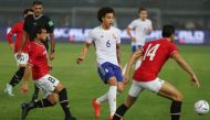 Egypt's players mark Belgium's midfielder Axel Witsel (C) during the friendly football match between Belgium and Egypt at the Jaber Al-Ahmad Stadium in Kuwait City on November 18, 2022. (Photo by Yasser Al-Zayyat / AFP