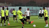 Senegal legend El Hadji Diouf with players during a training session in Doha, yesterday. AFP