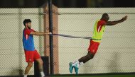 Canada's Jonathan Osorio and Atiba Hutchinson during training session at Umm Salal SC Training Facilities, Qatar, November 20, 2022. (REUTERS/Annegret Hilse)