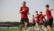 Wales’ forward Gareth Bale warms up with his team mates during a training session at the Al Saad SC in Doha. AFP