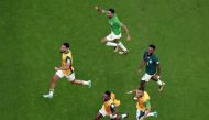 November 22, 2022 Saudi Arabia's Saleh Al-Shehri, Nawaf Al Abid and teammates celebrate after the match REUTERS/Peter Cziborra