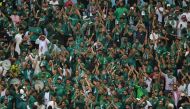 Saudi Arabia supporters celebrate their victory in the Qatar 2022 World Cup Group C football match between Argentina and Saudi Arabia at the Lusail Stadium in Lusail, north of Doha on November 22, 2022. (Photo by JUAN MABROMATA / AFP)