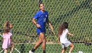 Netherlands' defender Virgil van Dijk plays with his children during a meeting with relatives after a training session at Qatar University training ground in Doha on November 22, 2022 during the Qatar 2022 World Cup football tournament. (Photo by Alberto PIZZOLI / AFP)