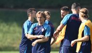 Croatia's midfielder Luka Modric (left) takes part in a training session at the Al Erssal training site in Doha on November 22, 2022, on the eve of the Qatar 2022 World Cup football tournament Group F match between Morocco and Croatia. (Photo by OZAN KOSE / AFP)