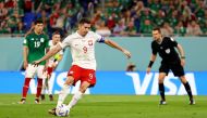 Poland's Robert Lewandowski has a penalty kick saved by Mexico's Guillermo Ochoa during the FIFA World Cup Qatar 2022 Group C - Mexico v Poland - Stadium 974, Doha, Qatar, November 22, 2022. (REUTERS/Hannah Mckay)