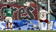 Poland’s Robert Lewandowski has his penalty saved by Mexico’s Guillermo Ochoa during their Group C match at Stadium 974 yesterday. REUTERS