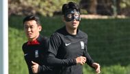 South Korea's defender #23 Kim Tae-hwan (L) and South Korea's midfielder #07 Son Heung-min take part in a training session at Al Egla Training Site 5 in Doha on November 23, 2022, on the eve of the Qatar 2022 World Cup football match between Uruguay and South Korea. (Photo by JUNG Yeon-je / AFP)