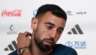 Portugal's midfielder Bruno Fernandes holds a press conference at the Qatar National Convention Center (QNCC) in Doha on November 23, 2022, on the eve of the Qatar 2022 World Cup football match between Portugal and Ghana. (Photo by PATRICIA DE MELO MOREIRA / AFP)