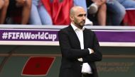 Morocco's coach Walid Regragui watches his players from the touchline during the Qatar 2022 World Cup Group F football match between Morocco and Croatia at the Al-Bayt Stadium in Al Khor, north of Doha on November 23, 2022. (Photo by MANAN VATSYAYANA / AFP)