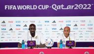 Ghana's coach Otto Addo (left) and player Andre Ayew attend a press conference at the Qatar National Convention Center (QNCC) in Doha, on November 23, 2022, on the eve of the Qatar 2022 World Cup football match between Portugal and Ghana. (Photo by Khaled DESOUKI / AFP)