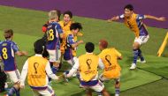 Japan's Takuma Asano celebrates scoring their second goal with teammates. (REUTERS/Molly Darlington)