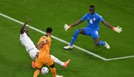 Senegal's defender #03 Kalidou Koulibaly (C) fights for the ball with Netherlands' forward #08 Cody Gakpo (C) as Senegal's goalkeeper #01 Edouard Mendy during the Qatar 2022 World Cup Group A football match between Senegal and the Netherlands at the Al-Thumama Stadium in Doha on November 21, 2022. (Photo by MANAN VATSYAYANA / AFP)