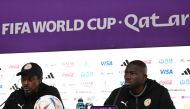 Senegal's coach Aliou Cisse (left) and Senegal's defender Kalidou Koulibaly attend a press conference at the Qatar National Convention Center (QNCC) in Doha on November 24, 2022, on the eve of the Qatar 2022 World Cup football match between Qatar and Senegal. (Photo by OZAN KOSE / AFP)