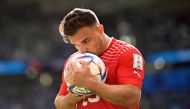 Switzerland's midfielder #23 Xherdan Shaqiri kisses the ball during the Qatar 2022 World Cup Group G football match between Switzerland and Cameroon at the Al-Janoub Stadium in Al-Wakrah, south of Doha on November 24, 2022. (Photo by Kirill KUDRYAVTSEV / AFP)