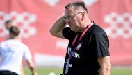 Poland's coach Czeslaw Michniewicz attends a training session at the Al Kharaitiyat SC in Doha on November 23, 2022, during the Qatar 2022 World Cup football tournament. (AFP/Andrej Isakovic)