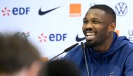 France's forward Marcus Thuram smiles during a press conference at the Jassim-bin-Hamad Stadium in Doha on November 24 , 2022, during the Qatar 2022 World Cup football tournament. (Photo by FRANCK FIFE / AFP)