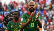 Cameroon’s defender Nouhou Tolo and forward  Eric Maxim Choupo-Moting applaud after their match against Switzerland. AFP