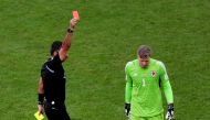 Wales' Wayne Hennessey is shown a red card by referee Mario Escobar REUTERS/Marko Djurica