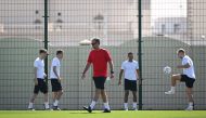 Denmark's coach Kasper Hjulmand leads a training session of his team at Al Sailiya SC in Doha on November 24, 2022. (Photo by Natalia KOLESNIKOVA / AFP)