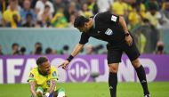 Iranian referee Alireza Faghani gestures to Brazil's forward Neymar during the Qatar 2022 World Cup Group G football match between Brazil and Serbia at the Lusail Stadium in Lusail, north of Doha, on November 24, 2022. (Photo by NELSON ALMEIDA / AFP)