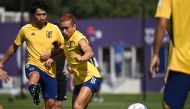 Japan's defender Yuto Nagatomo (right) along with his teammate takes part in a training session at Al Sadd SC in Doha on November 26, 2022, on the eve of the Qatar 2022 World Cup football match between Japan and Costa Rica. (Photo by Philip FONG / AFP)