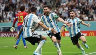 Argentina's Lionel Messi celebrates scoring their first goal against Mexico with Julian Alvarez and Angel Di Maria at the Lusail Stadium in Lusail, Qatar, on November 26, 2022. REUTERS/Pedro Nunes.