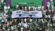 Saudi Arabia fans with a banner in support of Salman Al-Faraj and Yasser Al-Shahrani inside the Education City Stadium in Qatar, before the match against Poland on November 26, 2022. (REUTERS/Molly Darlington)