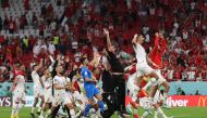 Morocco players celebrate after the their  FIFA World Cup Qatar 2022 Group F win against Belgium at the Al Thumama Stadium, Doha, Qatar, on November 27, 2022.  REUTERS/Matthew Childs
 